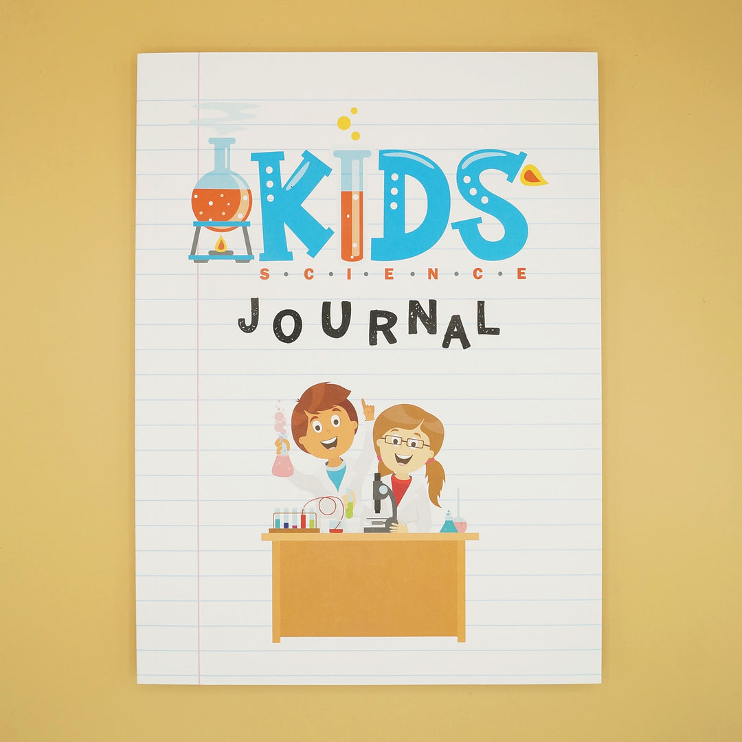 a notebook labeled Kids Science Journal with a cartoon image on the front of two children at a desk with science equipment