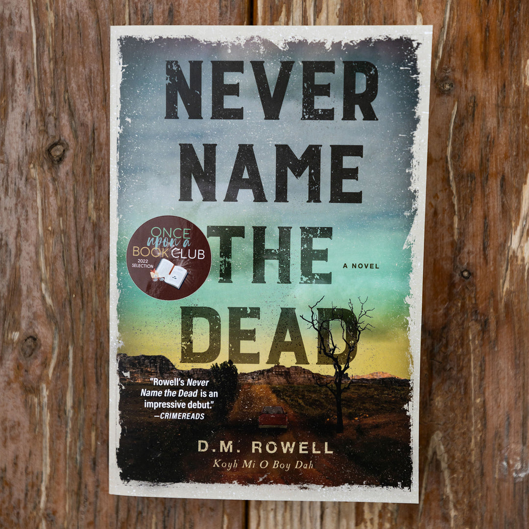 paperback edition of Never Name the Dead by DM Rowell