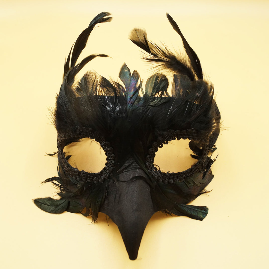 a black feathered bird masquerade mask