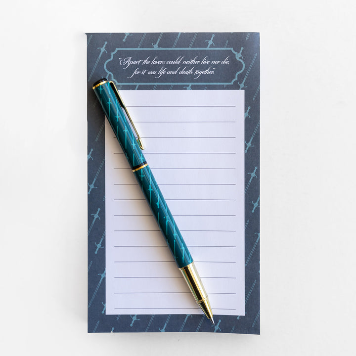 Notepad with a pen on a white background