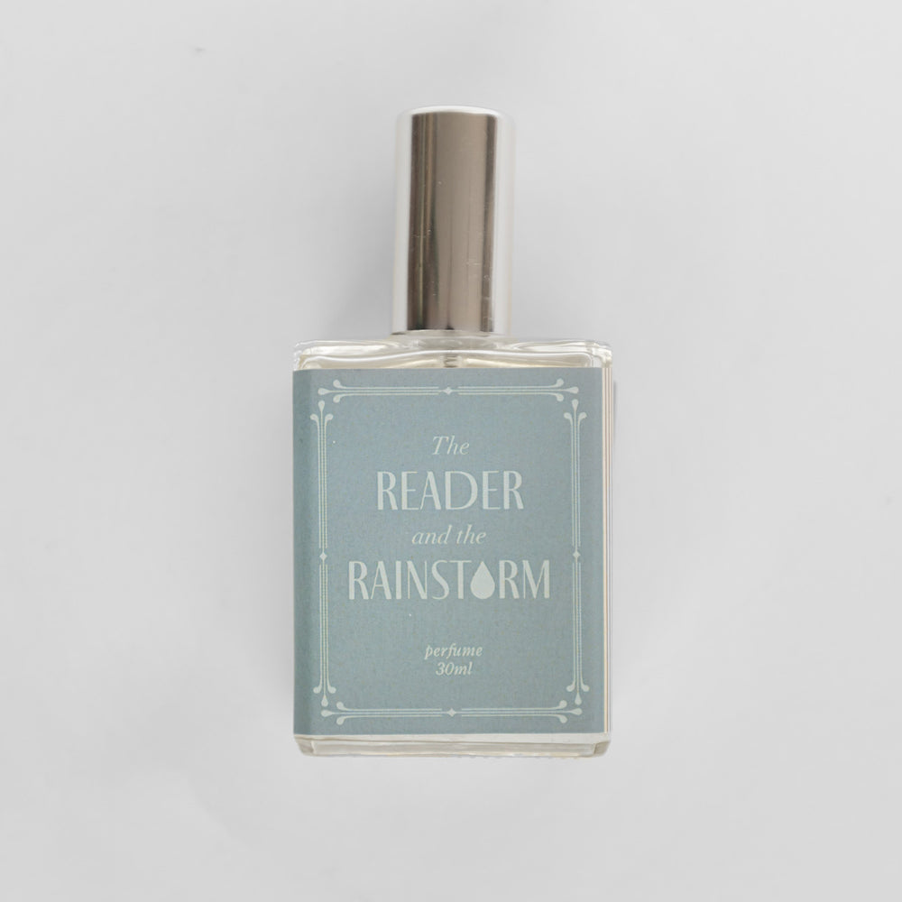 A closeup of the bottle containing the fragrance "The Reader and the Rainstorm".