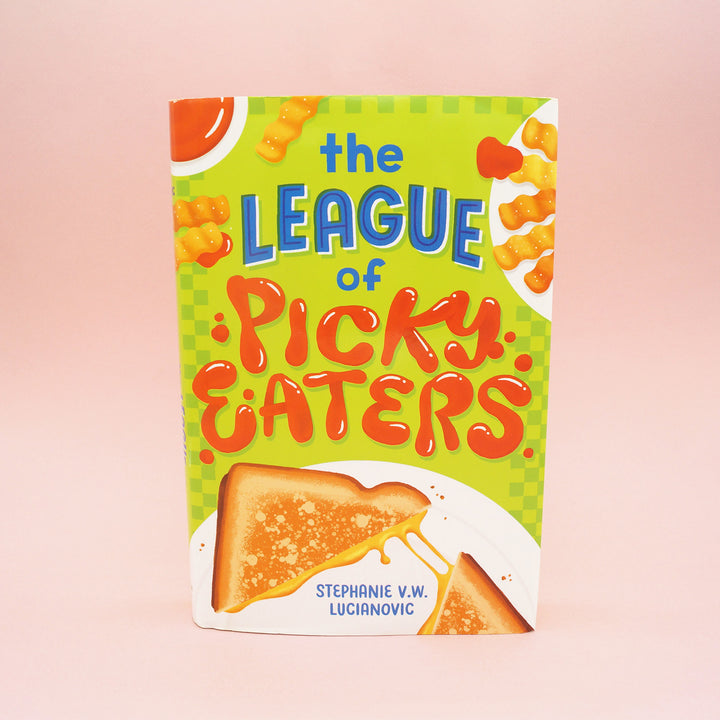 A hardcover copy of The League of Picky Eaters by Stephanie V.W. Lucianovic.