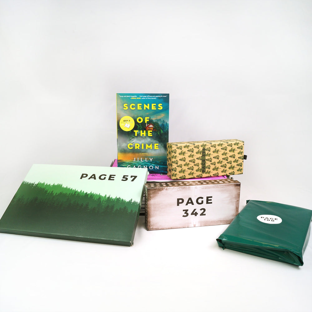 a paperback copy of Scenes of the Crime and a box with trees on it sit on a pink box. In front of the pink box are a large box with an image of a forest, a rectangular box, and a green polybag. The boxes and bags all have page numbers.