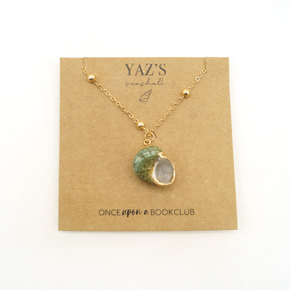 a green and gold seashell necklace with a gold chain