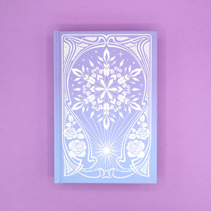The hard case of 'The Sun and the Starmaker' by Rachel Griffin showcasing an intricate, winter design on a purple background.