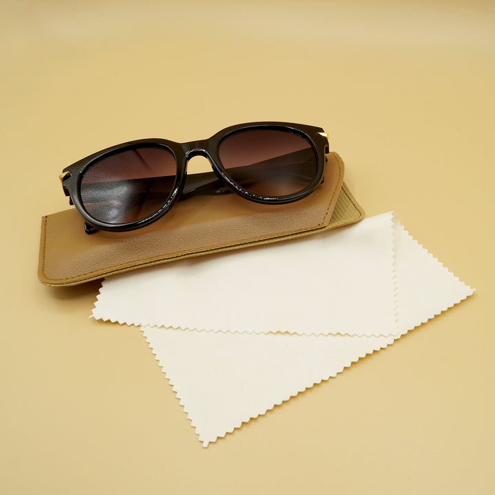 black sunglasses sit on a brown case with eyeglass cleaning cloth