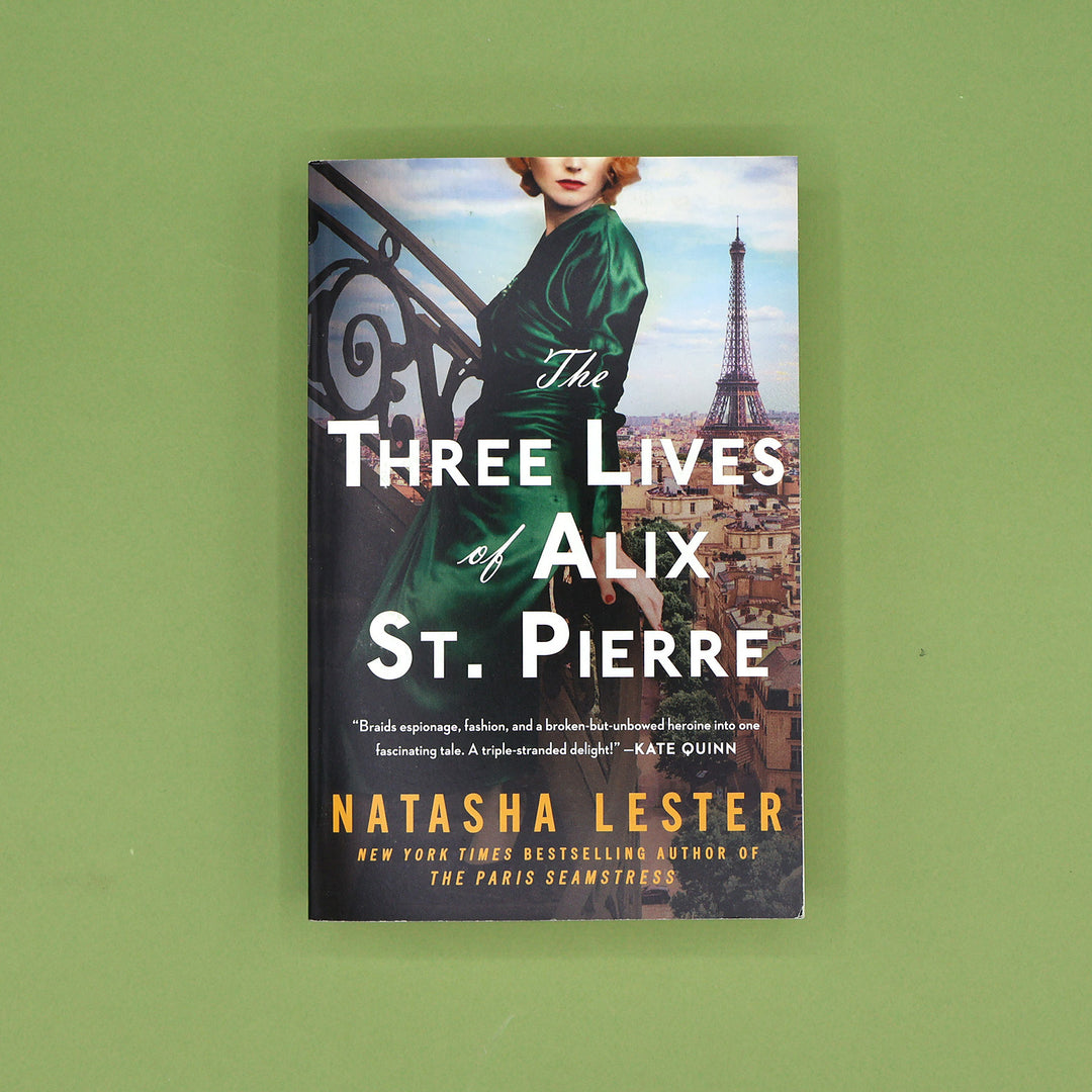 Book cover of 'The Three Lives of Alix St. Pierre' by Natasha Lester on a green background