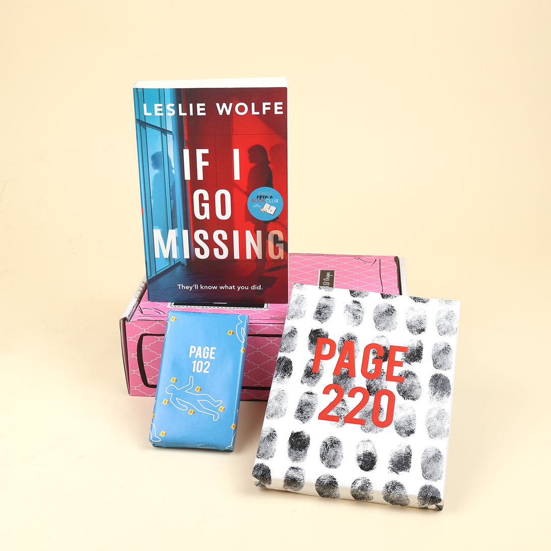 The Thriller Mini box items featuring the book 'If I Go Missing' by Leslie Wolfe, a pink hardcover edition, a blue wrapped gift labeled 'PAGE 102', and a white gift wrapped with a black fingerprint pattern and red text reading 'PAGE 220', arranged on a beige background.