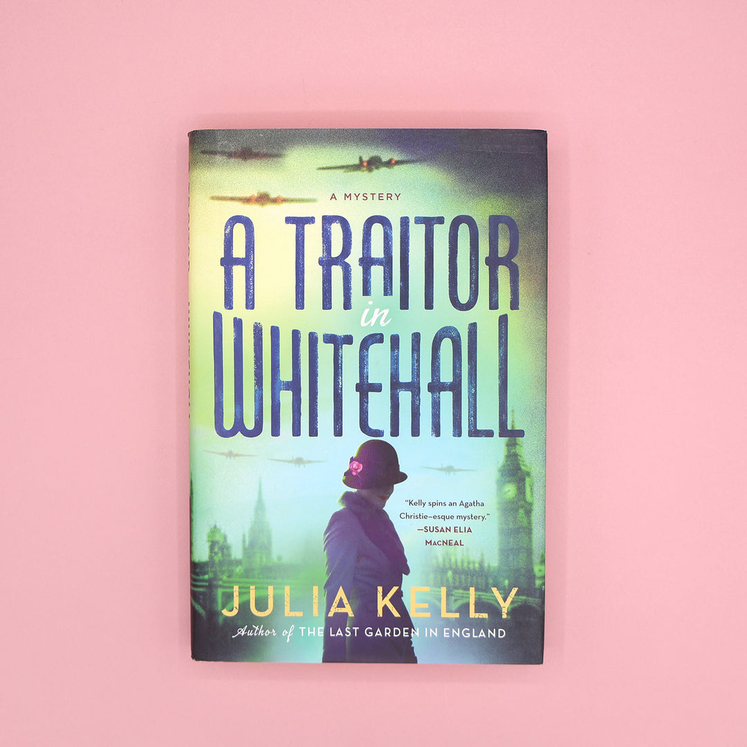 Book cover of 'A Traitor in Whitehall' by Julia Kelly on a pink background