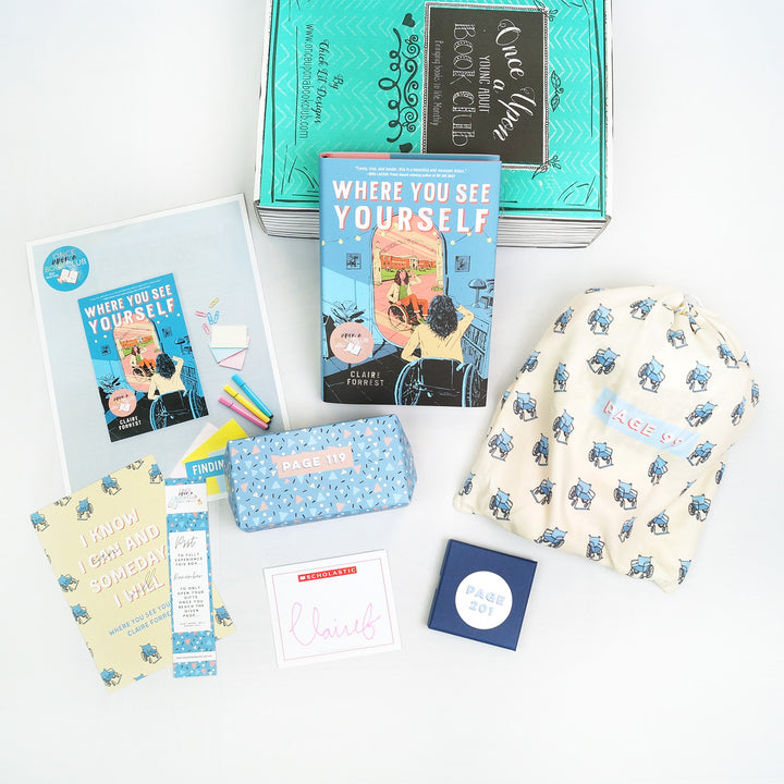 A hardcover edition of Where You See Yourself leans against a green box. In front are a bookclub kit, quote card, bookmark, signature card, light blue rectangular box, blue square box, and white drawstring bag. The boxes and bags all have page numbers.