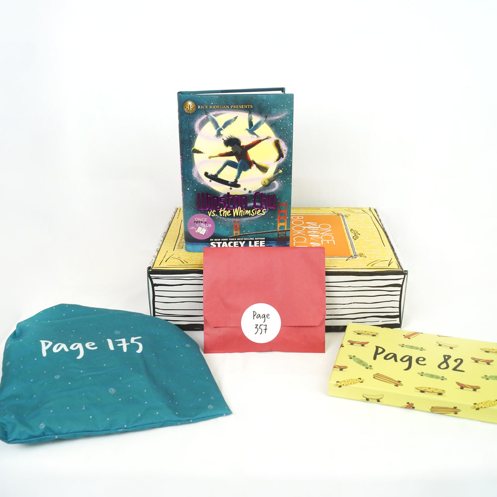 A hardcover edition of Winston Chu vs the Whimsies is on a yellow Once Upon a Book Club box. In front of the box are a teal drawstring bag, red envelope, and yellow box. The boxes and bags all have page numbers.