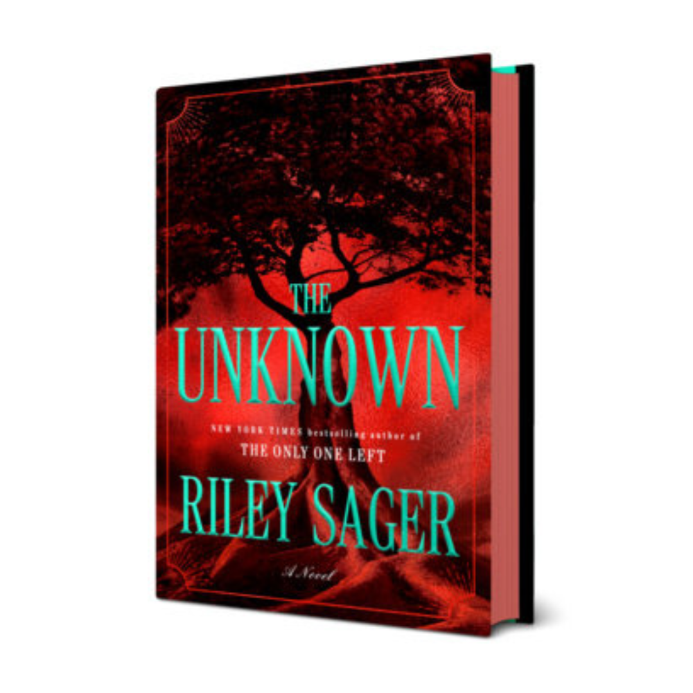 A hardcover copy of The Unknown by Riley Sager featuring red sprayed page edges.