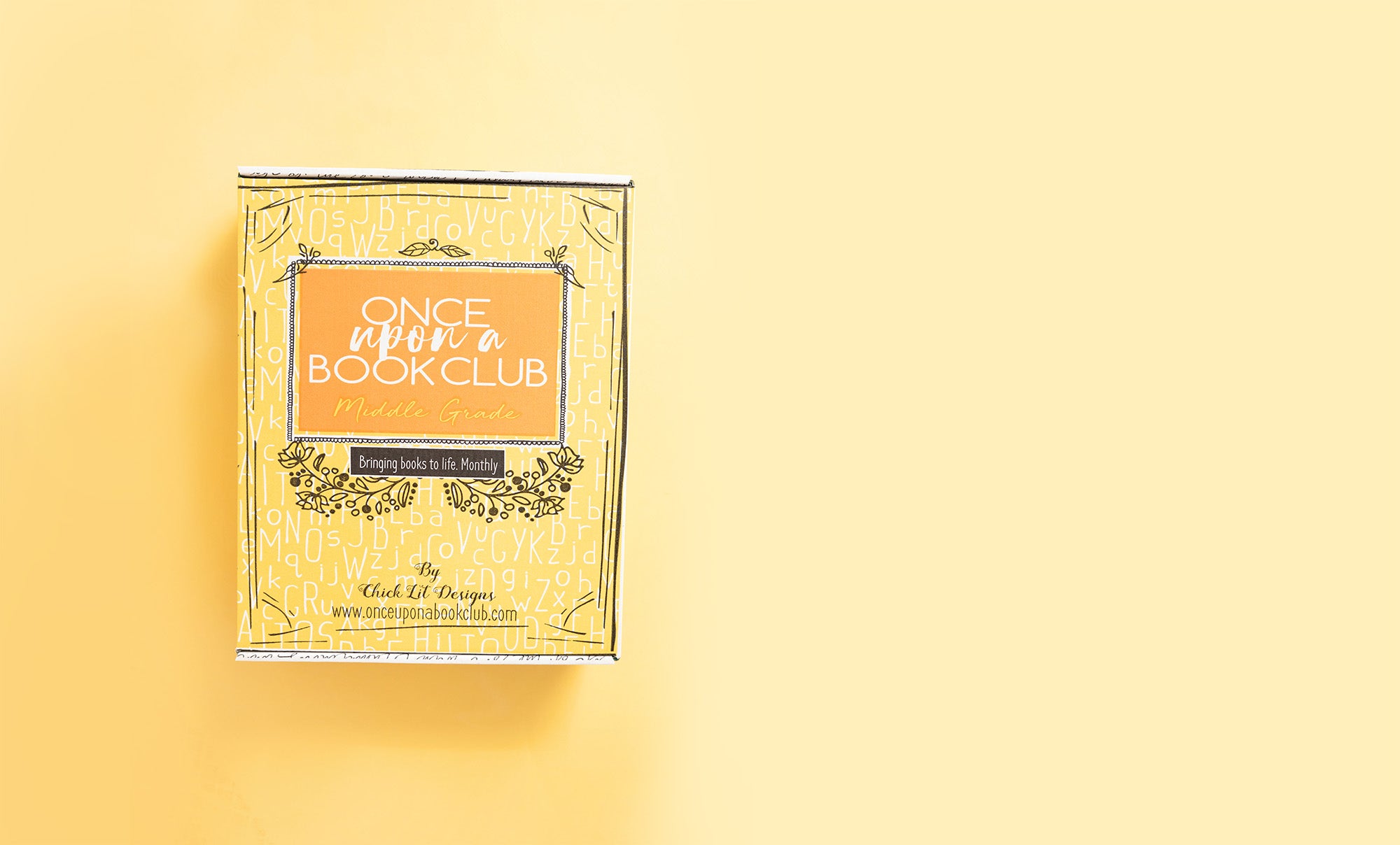 a yellow Once Upon a Book Club Middle Grade box