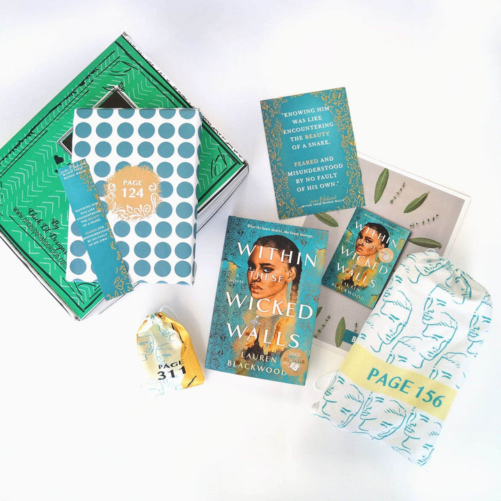 A white and blue polka-dot box and a bookmark are on a green Once Upon a Book Club box. Next to the box are a yellow drawstring bag, hardcover edition of Within These Wicked Walls, quote card, bookclub kit, and white drawstring bag. The boxes and bags all have page numbers.