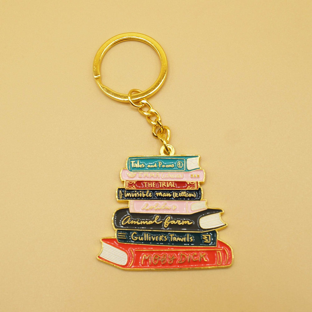a bookstack key chain with gold ring