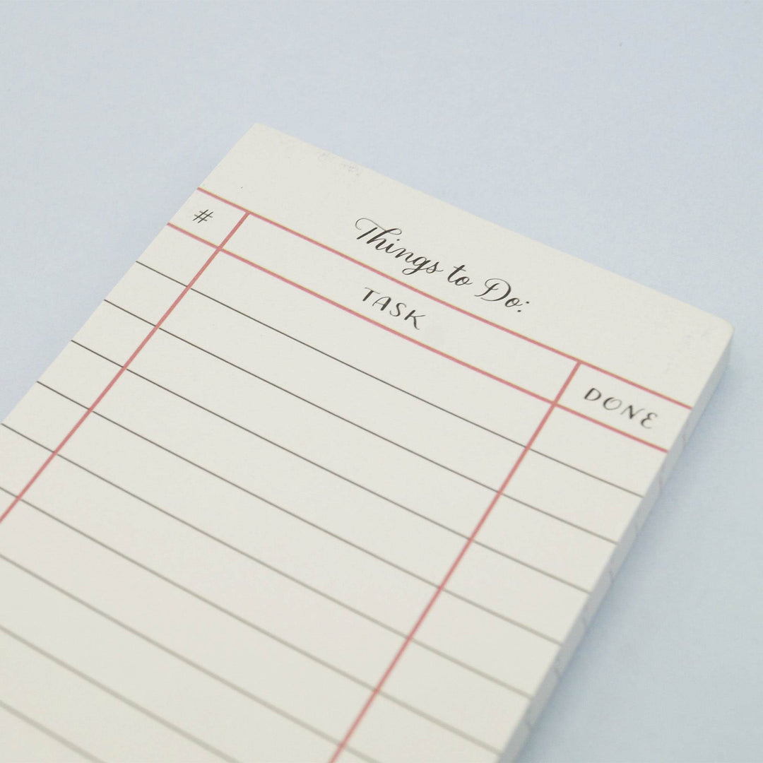 A white notepad labeled "Things to Do" with columns for #, task, and done