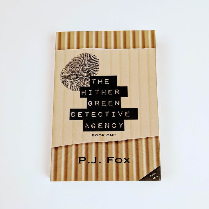 Book titled The Hither Green Detective Agency Book One by PJ Fox, with a fingerprint on the cover.