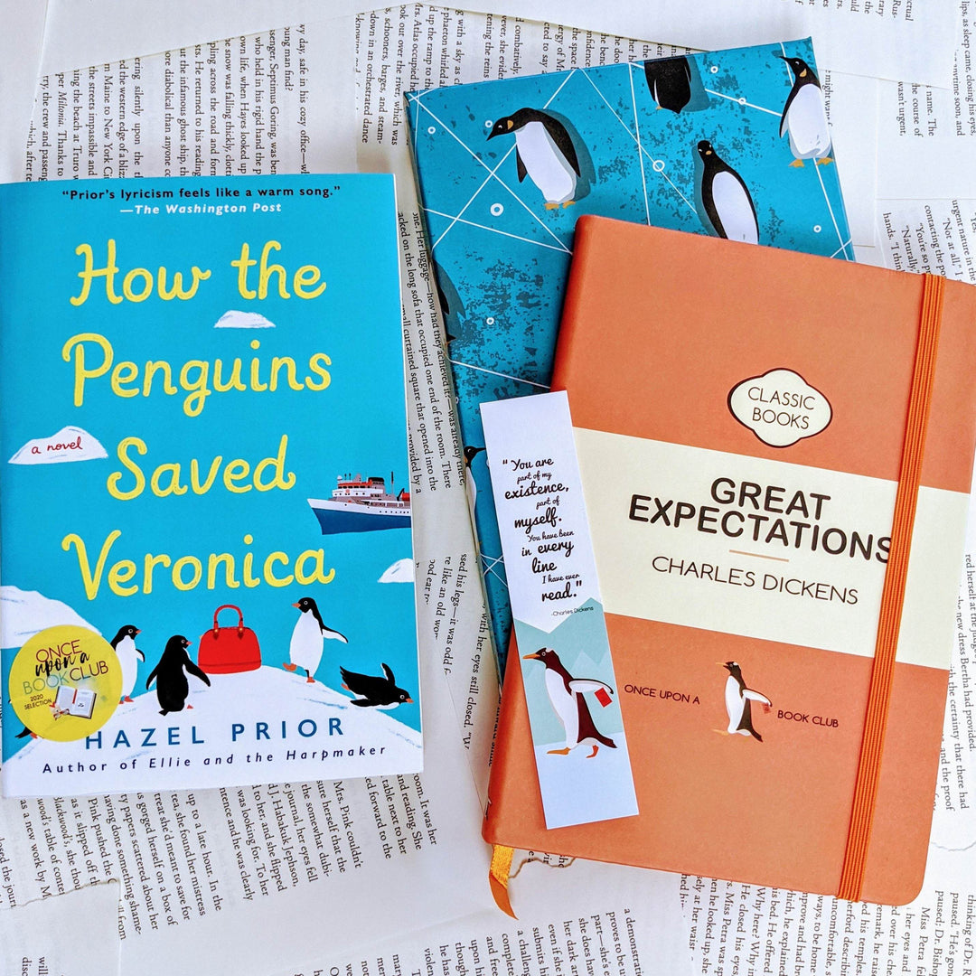 a paperback edition of How the Penguins Saved Veronica is next to an orange notebook labeled Great Expectations. On the notebook is a bookmark and underneath is a folder with penguins on it