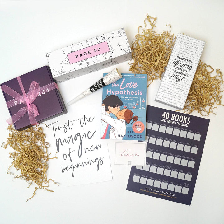 a paperback edition of The Love Hypothesis is surrounded by a purple box with pink bow, white box, quote card, signature card, white box, and 40 Book Reading Challenge