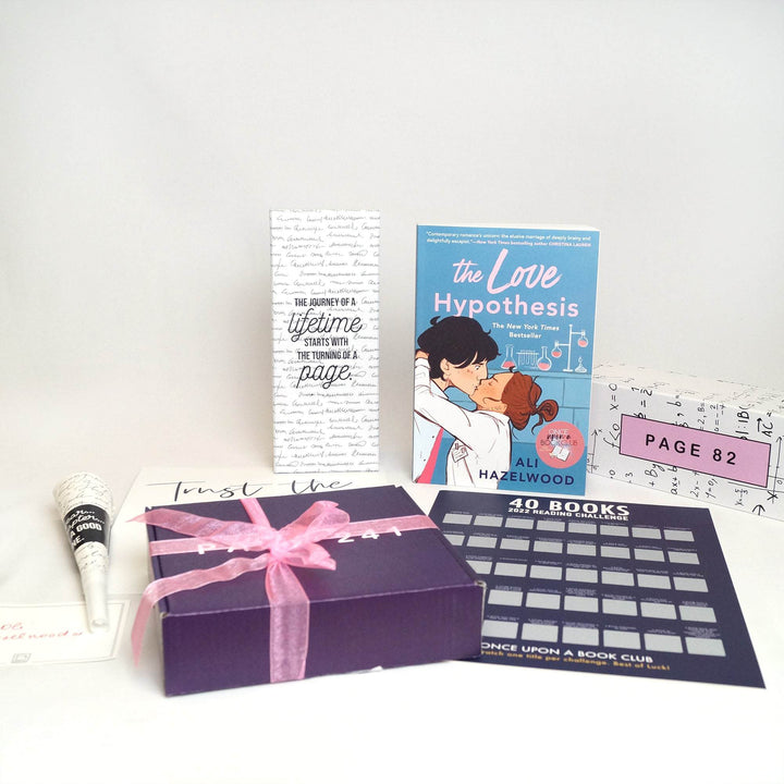 From left to right - signature card, noisemaker, purple box with pink box, quote card, white box, 40 book challenge poster, paperback edition of The Love Hypothesis, and white box.