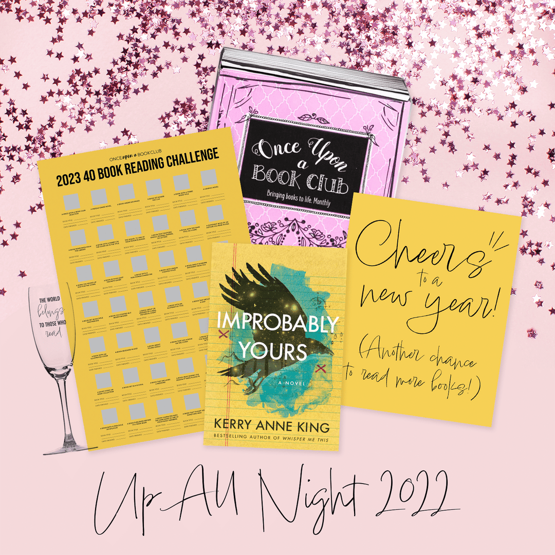 a pink Once Upon a Book Club box with a champagne flute, yellow 40 book reading challenge poster, paperback edition of Improbably Yours, and yellow quote card in front of it