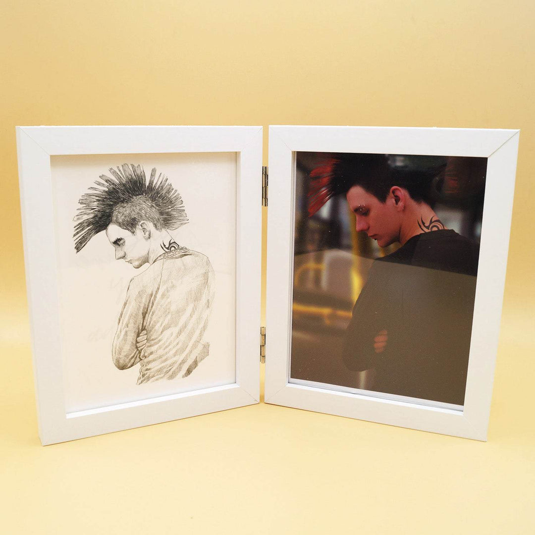 A white double-sided frame opens up to show an image on each side. the right side shows an image of a man in black with a mohawk and neck tattoo. The left side shows a sketch of the image on the right.