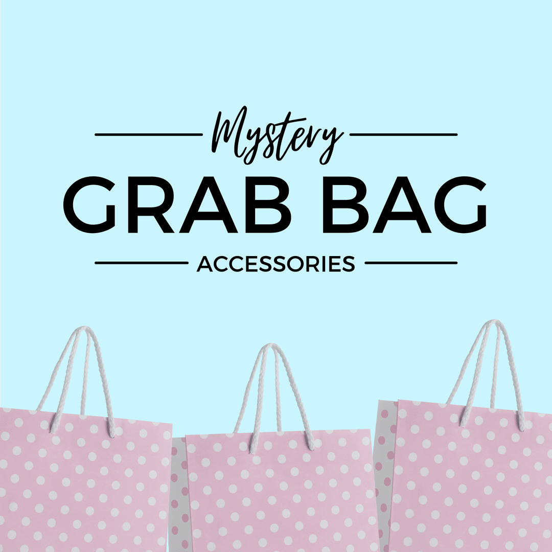 Mystery Grab Bag - Accessories. There are pink polkadot shopping bags along the bottom of the image.
