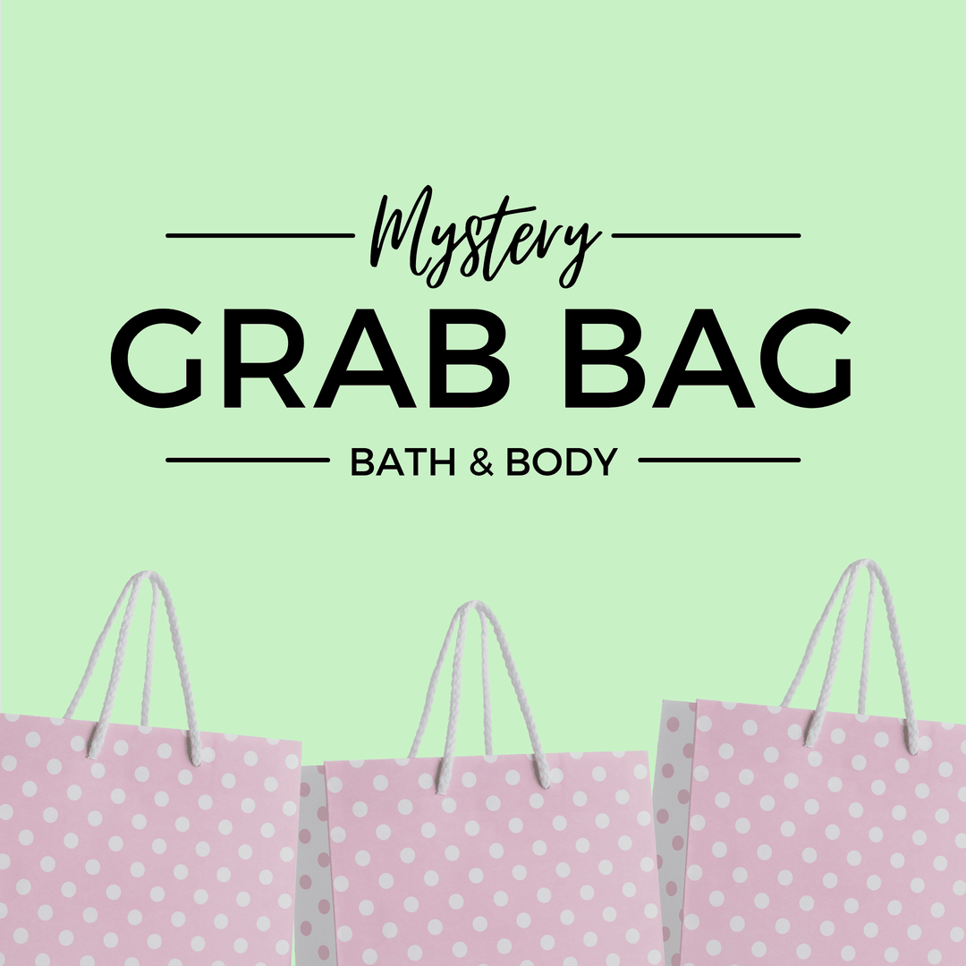 Mystery Grab Bag - Bath & Body. There are pink polkadot shopping bags along the bottom of the image.