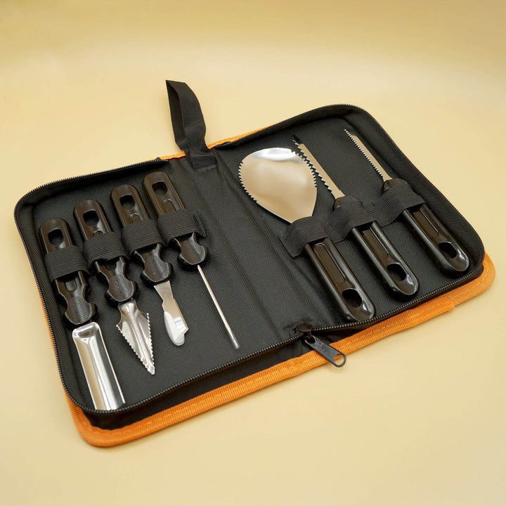 a pumpkin carving set lays open with seven different tools
