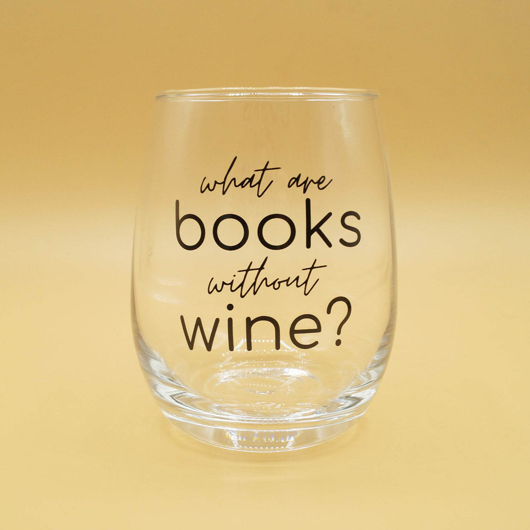 a stemless wine glass with the quote "What are books without wine?" in black letters
