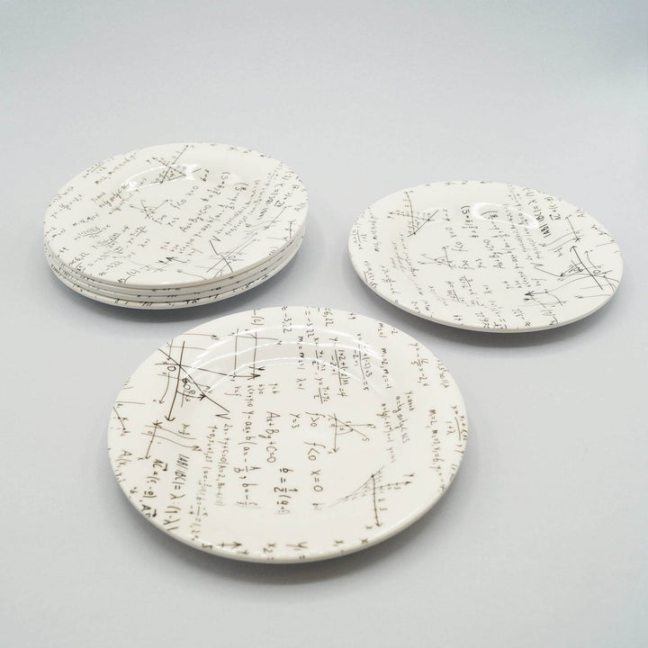 a set of six white sushi plates with black equations across them
