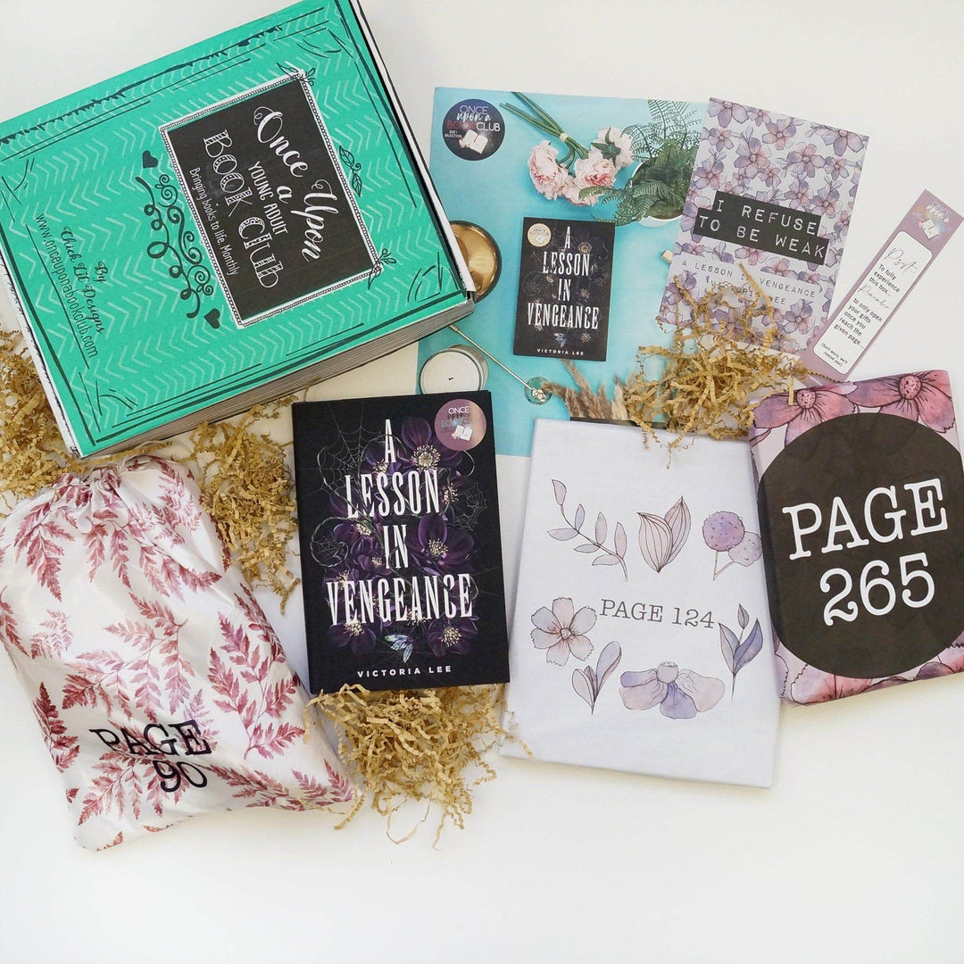 A green Once Upon a Book Club box is at the top left of the image. In front of the box are a pink and white drawstring bag, hardcover edition of A Lesson in Vengeance, bookclub kit, quote card, white box, bookmark, and pink and black box. The boxes and bags all have page numbers.